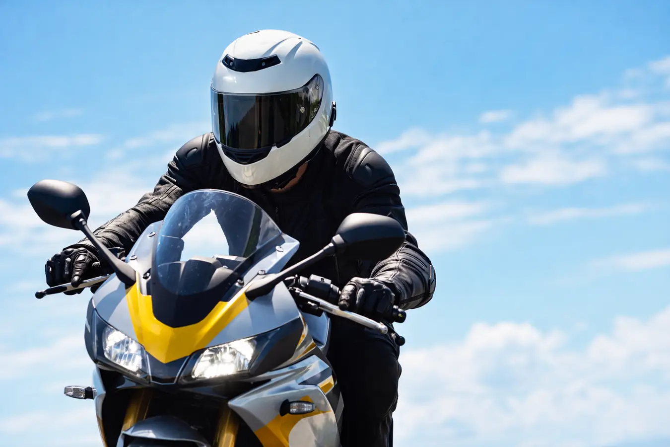 Motorcycle rider in bright daylight